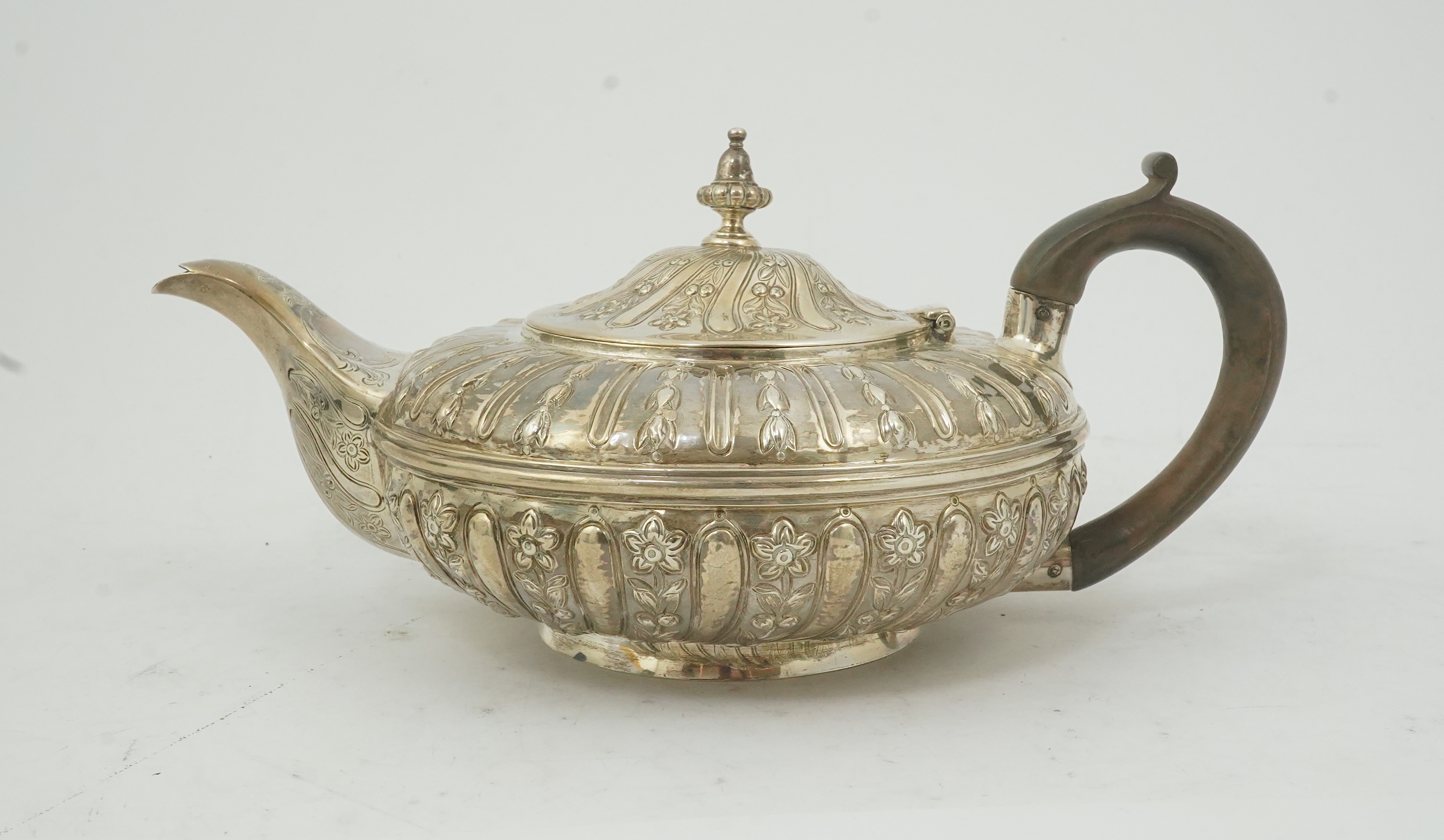 A William IV embossed silver teapot, by Joseph & John Angell